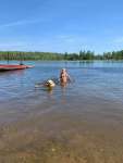 Man's best friend and favorite human at the beach of Northwind Lodge - Ely MN